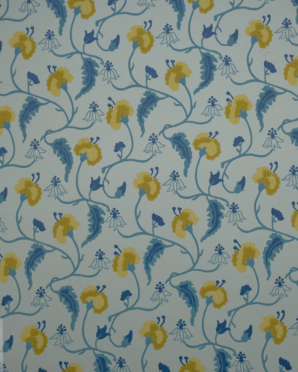 A repeating floral pattern wallpaper or fabric design featuring yellow flowers and blue leaves on a pale blue-gray background.